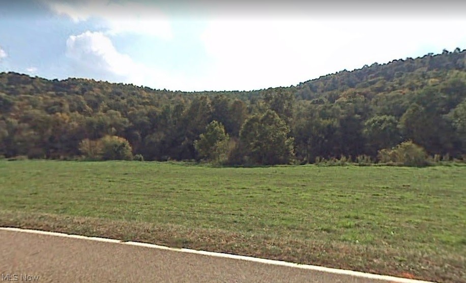 This is a fantastic piece of flat land in northern Washington County. The property is 2.79 acres and is located on scenic State Route 26 and borders the Little Muskingum River to the south. The property would make for a great recreational property or camp site. It is surrounded with 100's of acres of Wayne National Forest. Recreational activities nearby include hiking some of Ohio's best trail systems in Wayne National Forest, hunting, fishing, camping, covered bridges and some of the region's most scenic roadways. This property is Parcel #3. There are additional parcels of 2.340 acres, 1.207 acres and 3.22 acres. Act fast for your own little piece of paradise. Mineral rights do not transfer... survey has been completed.