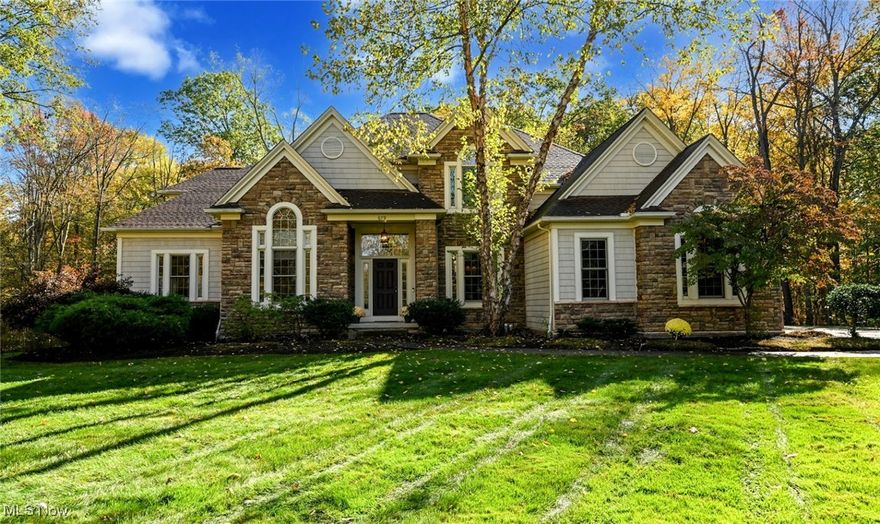 This beautiful home features almost 6,000 sq ft of finished space, set back off the road down a private drive and nestled in a wooded setting. All levels of the home exhibit custom design and quality construction. 
As you enter the two-story foyer with a split staircase, you immediately sense the quality and warmth of the home. The first-floor office/den provides a great workspace, complete with built-in desk and shelves. 
The great room, with its two-story wall of windows, allows natural light to flood the space. The gourmet kitchen boasts a huge granite island, custom cabinets, and high-end appliances that any chef would appreciate. The eating nook features a unique custom wooden ceiling that adds character to the home.
The first-floor master suite offers convenient living for those who prefer to avoid stairs. On the second floor, you will find three additional bedrooms, each with access to a full bathroom.
Head down to the lower level to discover a bonus room complete with a pool table, along with another full bathroom adjacent to it.
All of this is situated on a private 1.8-acre wooded lot within the highly desirable Aurora School District. This home is truly one-of-a-kind, set in an exceptional location.