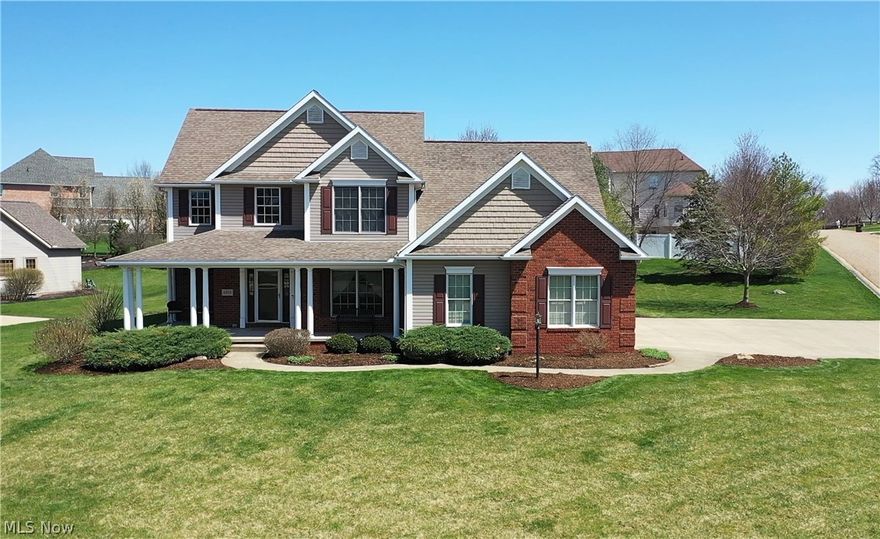 Welcome to this Beautiful four-bedroom home in Wellington Woods in Plain township. This gorgeous home is immaculate, spacious, bright & airy, with an inviting front porch. An open floor plan welcomes you as you enter this grand two-story/Great Room with ceilings 22 feet high and an incredible gas fireplace is a beautiful focal point. The great room opens to the spacious eat-in kitchen with Bolon's hickory cabinets, ceramic flooring, granite counters, stainless appliances, a breakfast bar, and a dining area with sliders to the patio. Convenient 1rt-floor master suite complete with deluxe bath, his and hers sinks, corner soaking tub, separate shower, and extra-large (13x8) custom walk-in closet with built-in shelves. A formal dining room, half bath, and convenient laundry with utility sink/closet/cabinets & access to the three-car side load garage complete the main floor. Enjoy the view from the catwalk to the great room on the 2nd floor that offers three bedrooms with large closets and