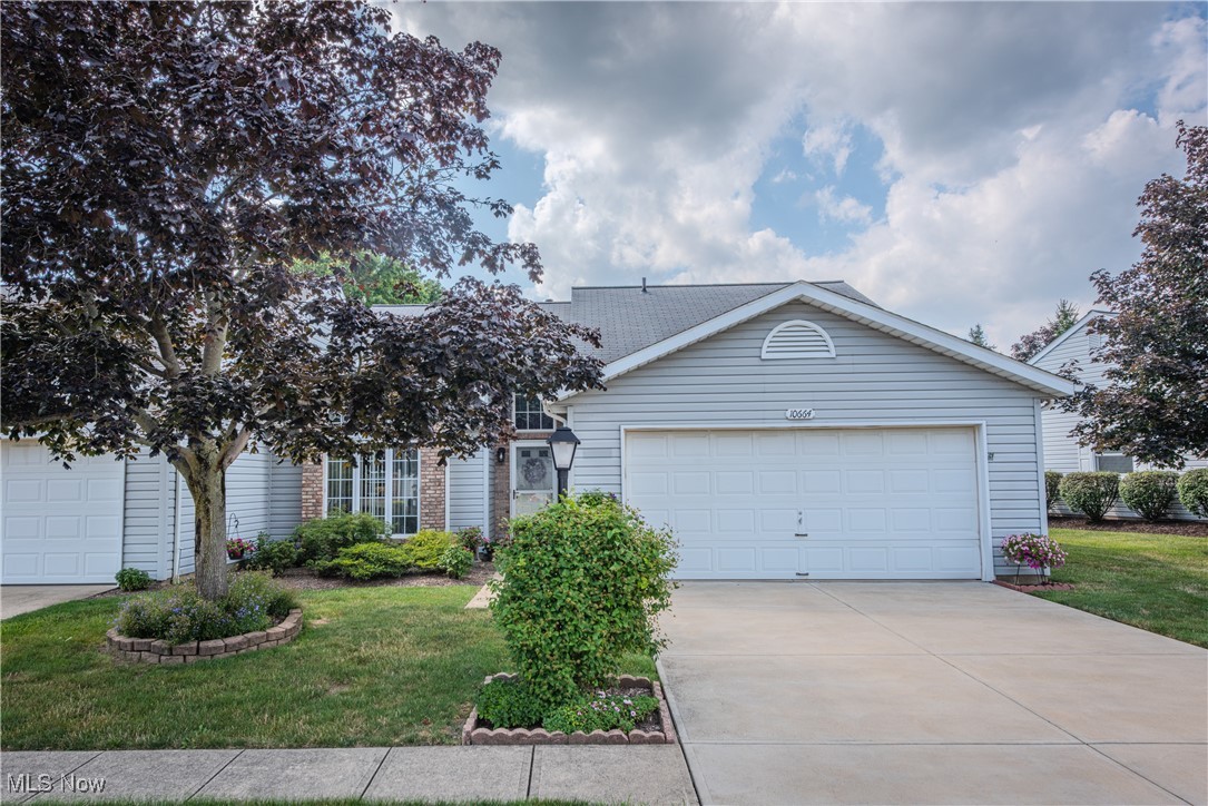 Welcome to this well-maintained cluster home in the desirable Bryn Mawr community. This 2-bedroom, 2-bath ranch features a spacious first-floor primary suite, vaulted ceilings, and an open floor plan. Enjoy the convenience of first-floor laundry and an attached 2-car garage. The kitchen offers a breakfast bar and opens to a rear patio—perfect for relaxing or entertaining. Head upstairs to the second floor loft to find the second bedroom with plenty of natural light, a second full bathroom and a gas fireplace. Recent updates include upstairs windows (2024), first floor windows (2020), air conditioner (2021), hot water tank (2023), and custom blinds and shades throughout. Both bathrooms have been updated. New driveway installed in 2018.