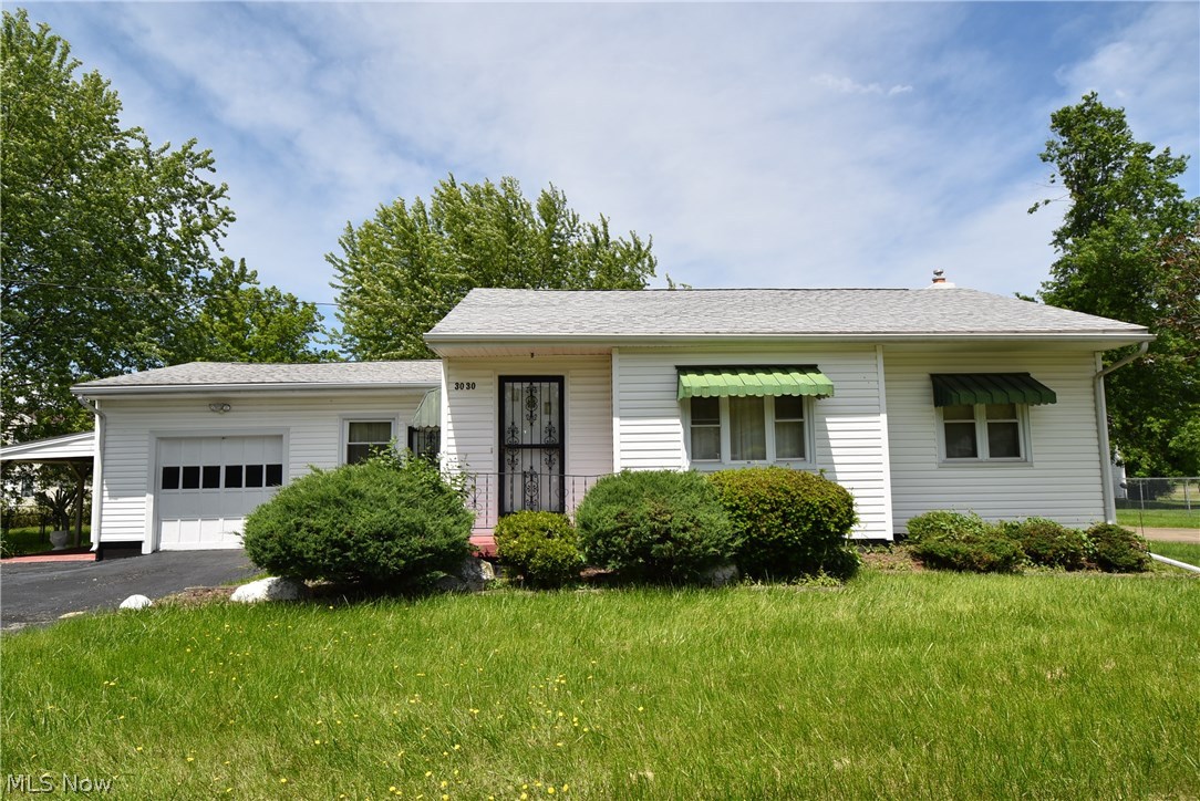 Looking for city living with a little room to spread out? Take a look at this. The property includes 7 lots totaling just under a half acre! Pull in to the attached garage and store your toys in the two car detached with paved drive and the extra large shed with overhead door. The yard has a fenced in area that could be used for children or pets at play. Roof, windows, and HVAC are newer. Finish it off with some interior decorating and move right in!