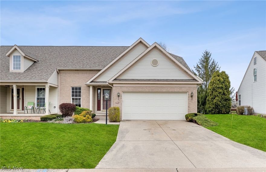 Come check out this beautifully updated condo in Green! The kitchen features gorgeous new grainte counters, new appliances, new hardware, new LVP flooing and a beautiful new subway tile backsplash. The two story living room with a gas fireplace will take your breath away. Convenient first floor master with ensuite bath and first floor laundry. The second floor features a large loft area that's perfect for a tv room or office area, a large second bedroom and a second full bathroom. Both full bathrooms have new granite counters, faucets and flooring. All new paint, flooring, light fixtures and hardware througout the entire condo. There's even a new garage door and garage door opener. Beautful lake and walking trail right in your backyard. Close to I-77, 6 golf courses and all of the shopping and restaurants that Green has to offer. Nothing to do here, just move right in! Agent Owned.