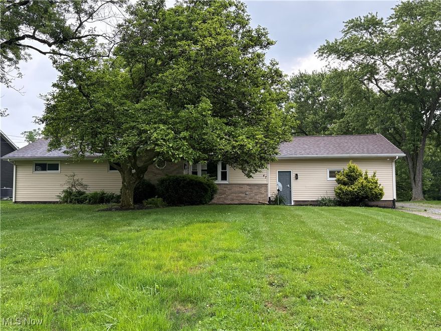 Spacious updated Ranch with 5 bedrooms. Over a half an acre of land and a 4.5 car garage. Large Eat-in-Kitchen with tiled back splash. It is centered between a large Morning room and a Great room with a shiplap accent wall. Three bedrooms with 2 full remodeled/updated bathrooms. The Master suite has a walk-in closet with a private full bath and tiled shower. Lower level with a large rec room and a fireplace. Two decent sized bedrooms on each end. Another full bathroom in the basement with a new epoxy floor. Laundry closet and large storage room with new epoxy floor. Outside has an attached 2 car garage and a detached 2.5 car garage with attached screened in porch. Beautiful yard to see all the wildlife. Updates include many new windows, exterior doors, flooring, recessed lighting, garage door on detached garage. Whole house painted on May 25 with new carpet in basement on the same day. Must see! Don't miss this one!