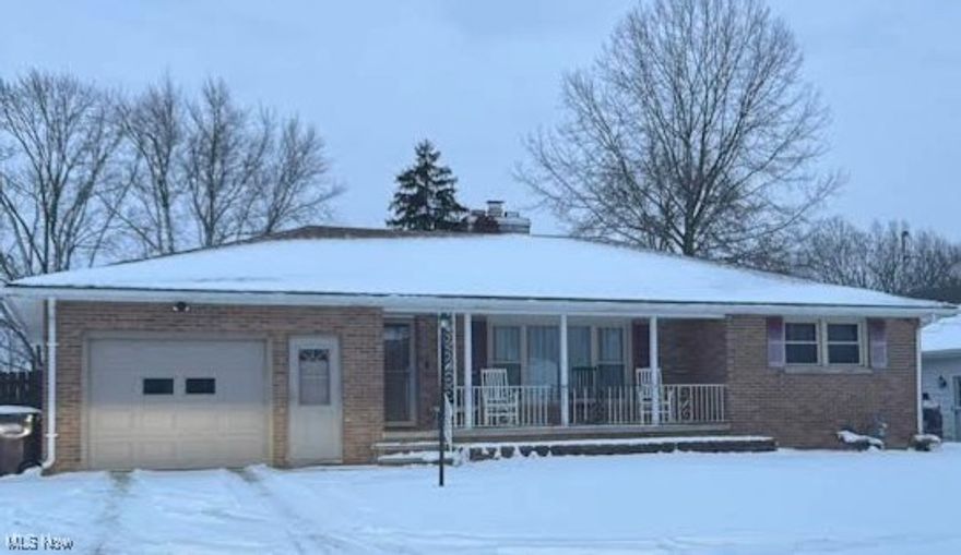 Charming mid century brick ranch with an attached 1 car and a detached 2 car garage ( in Back yard).Perfect for a man cave or she shed with plenty of room for a garden and a fire pit all on a spacious .39 acre lot.
 Inside this home you will find 3 bedrooms 1.5 baths   Very large living room with large picture window overlooking front porch.  Living room boasts a fireplace and  leads to the eat in area. The kitchen has plenty of counter space and storage. Dining area offers a great view of the  backyard which is fenced in and has lots of room for a garden space and fire pit.  All three bedrooms and living room have hardwood flooring under the carpet and the lower level  recreation room has plenty of space for fun and games. Conveniently located near shopping and dining areas and easy access to 480 & rt 20 and is nearby to Elyria, the hospital,  Grafton and N Ridgeville.