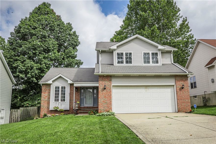 Welcome to Cherie Drive, perched atop a cul-de-sac in the NEWER CONSTRUCTION of Dicon Development sits this turn-key colonial. Over 2100 square feet of living gives everyone elbow room in this three bedroom, three bathroom home! Whether it's cooking up a meal in this massive kitchen complete with soaring vaulted ceilings, or lounging the deck off the sliders on your private spacious lot this homes a fit for anyone. Picture yourself cozied up just in time for the holidays infront of this gas burning fireplace. Nature Stone system has been installed in both the finished basement and two car garage, giving a polished look to all utility spaces. Choose your own carpet, (or apply to your closing costs) $2,000 seller's credit for the well loved bedroom flooring. See how sweet life can be perched atop the newest development in Garfield Heights!