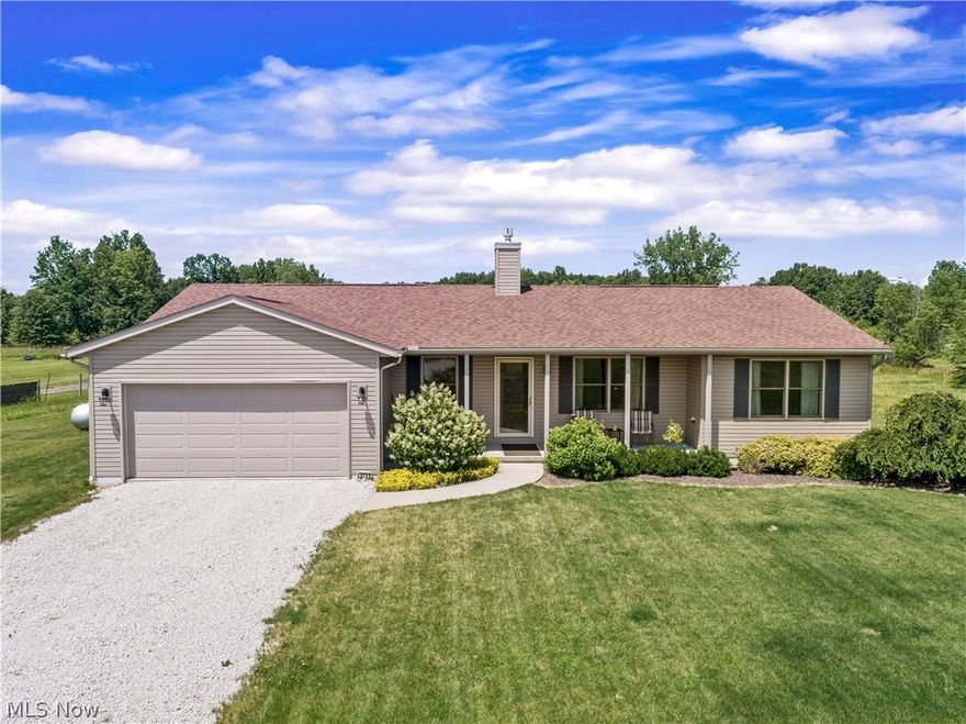 This 2014 built split bedroom ranch sits on 5 beautiful acres in Guilford Twp with wooded views overlooking the partially fenced backyard! A covered front porch ushers you into the front door to a great room with a gorgeous stone fireplace and vaulted & beamed ceilings. An open floor plan throughout the great room, dining area & kitchen make this home easy to entertain in! The kitchen offers lots of cabinetry with pull-out drawers, stainless appliances and a center island with breakfast bar! The laundry room is conveniently located on the first floor & has a large storage closet and access to the 2 car attached garage. The master bedroom has a walk in closet & private bath with a tiled shower! Two additional bedrooms & a guest bath are located at the opposite end of the home. A spacious sunroom has a cozy feel with vaulted, wood-clad ceiling, walls of windows & a sliding door leading to the concrete patio.The full basement is ready to be finished for additional living space! Don't miss