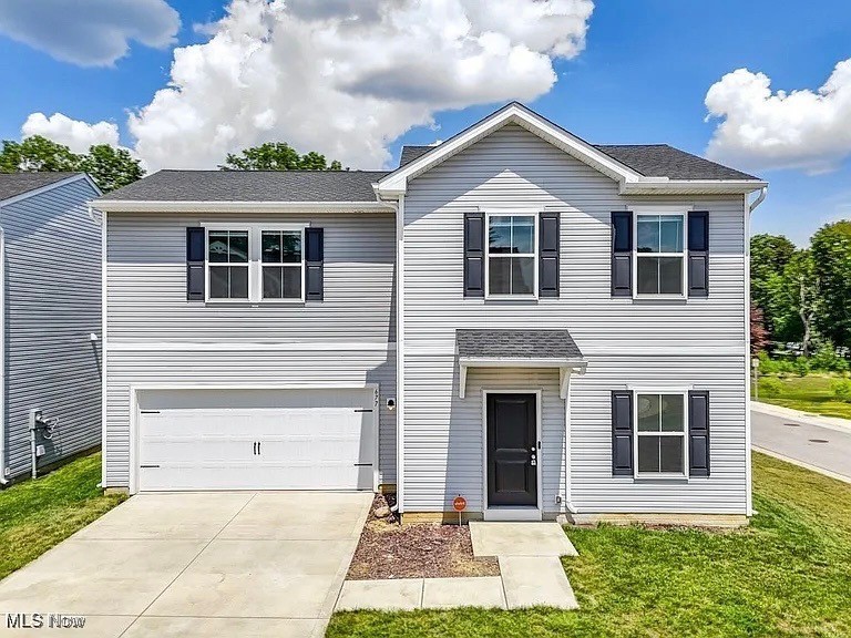 Why build when can you move right in to this immaculate, like-new home offering simplified living and ultimate convenience? Situated near several amenities, this 2022 build perfectly blends sleek, tasteful design with comfort and peace of mind. The open concept first level features a gorgeous white kitchen with SS appliances & contemporary track lighting, the cozy living room with modern laminate flooring, a powder room, and access to the spacious 2-car garage and fully-fenced in back yard. Head upstairs to the peaceful Primary Suite with a spa-like bath, two additional bedrooms, convenient laundry and a second full bath. The desirable Auld Farms community is fully-developed and nestled in the heart of Akron near the Zoo, Highland Square, and downtown attractions + dining. Near several highways, it also provides quick access to two major airports, Summit Mall, Aurora Farms shopping outlets, and highly-rated private schools. Equipped with a state-of-the-art security system. You will also enjoy the savings that comes with a 15-year tax abatement! Call your favorite agent for a showing today!