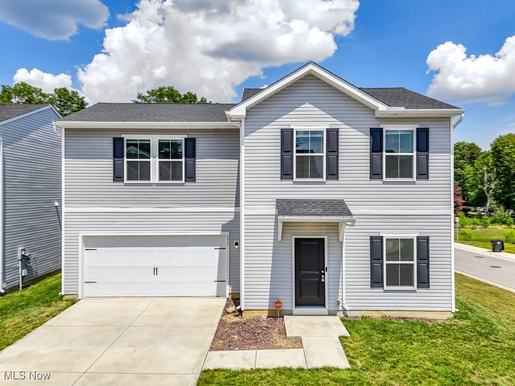 Why build when can you move right in to this immaculate, like-new home offering simplified living and ultimate convenience? Situated near several amenities, this 2022 build perfectly blends sleek, tasteful design with comfort and peace of mind. The open concept first level features a gorgeous white kitchen with SS appliances & contemporary track lighting, the cozy living room with modern laminate flooring, a powder room, and access to the spacious 2-car garage and fully-fenced in back yard. Head upstairs to the peaceful Primary Suite with a spa-like bath, two additional bedrooms, convenient laundry and a second full bath. The desirable Auld Farms community is fully-developed and nestled in the heart of Akron near the Zoo, Highland Square, and downtown attractions + dining. Near several highways, it also provides quick access to two major airports, Summit Mall, Aurora Farms shopping outlets, and highly-rated private schools. Equipped with a state-of-the-art security system. You will also enjoy the savings that comes with a 15-year tax abatement! Call your favorite agent for a showing today!