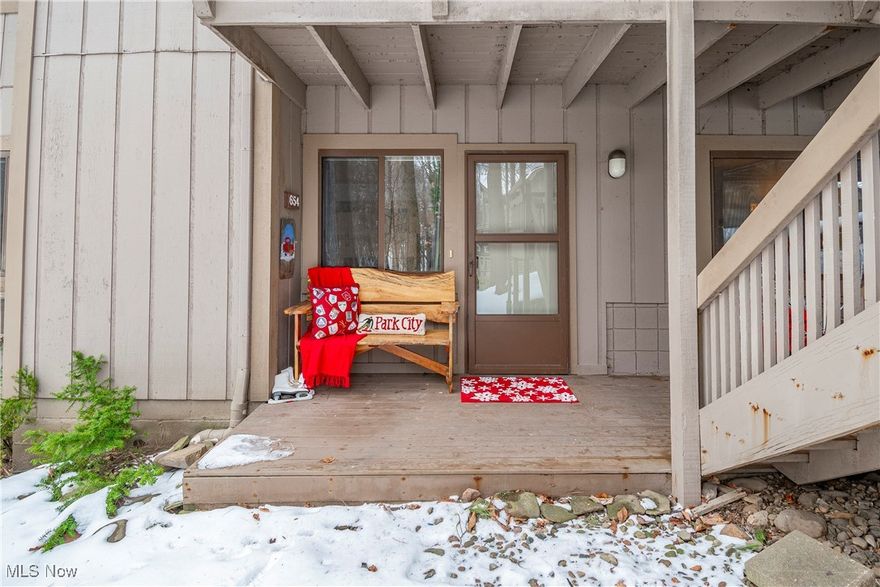 Welcome to this beautifully renovated 2-bedroom, 2-bathroom condo in the highly sought-after Pine Mill Ridge #4 development! This charming first-floor unit offers a spacious open floor plan, perfect for modern living. The inviting living room features a cozy wood-burning fireplace, providing warmth and ambiance. The remodeled kitchen is a true standout, boasting stunning quartz countertops, brand-new appliances, and custom cabinetry that blends style and functionality seamlessly. Adjacent to the kitchen, the dining room is enhanced by more new cabinetry and a matching quartz countertop, ideal for both everyday meals and entertaining guests. The family room offers access through sliding doors to a peaceful back deck that overlooks a serene wooded backyard—your own private retreat. The large owner's suite is a true sanctuary, offering double closets and a completely renovated en-suite bathroom. The generously sized guest bedroom with a large closet is perfect for guests, family, or a home office. Down the hall, you'll find another beautifully renovated full bathroom, as well as a laundry area with plenty of storage space. Both bathrooms have been thoughtfully updated with new showers, toilets, vanities, lighting, and faucets, ensuring a fresh, modern feel throughout. With its prime location in Pine Mill Ridge, this condo offers comfort, convenience, and style. Don't miss the opportunity to make this stunning home yours!