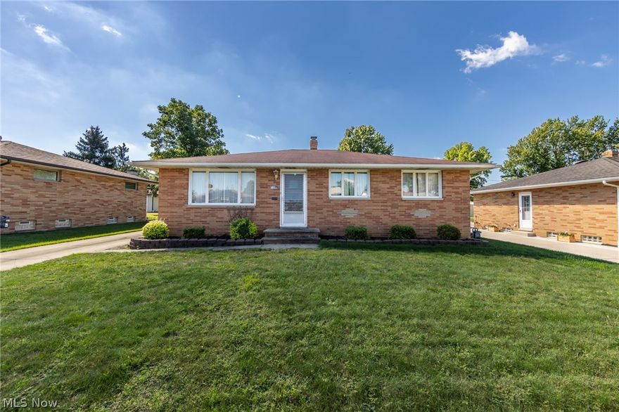 All Brick Ranch showcasing 3 bedrooms, 2 and a half baths is situated on a lovely property in Parma with a 2 car detached garage. Light and bright living room & conjoined dining area w/original wood floors under carpeting. Kitchen is complete with ample cabinetry, refrigerator & stove! 3 comfortable bedrooms with beautiful hardwood floors.  More living space is found in the fully finished basement with large recreation room, a second kitchen, ample storage, bathroom & laundry area. 1 year home warranty included. Call today to see how you can make this home your very own!