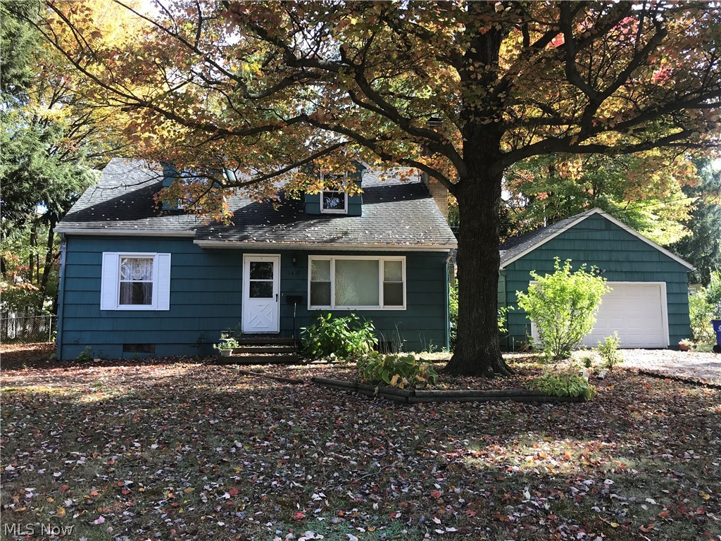 Welcome to this very charming 3 bed cape in Kent, Ohio on a 1/3 acre corner lot, close & convenient to Kent State University, shopping, eats & highways! The HUGE ceramic-floored kitchen with freshly painted cupboards is amazing with eat-in hardwood area (also allowing for table expansion for social gatherings!). New Windows 3 years ago!! Original hardwood floors in all bedrooms, living room, kitchen dining area. Fresh paint in living, kitchen/dining & two bedrooms. Upstairs bedrooms are HUGE w/ Full Jack n Jill bath! With the addition of a wall downstairs, current dining space could be easily transformed into bedroom 4 and still have significant kitchen eat-in area. Or if bedroom 4 is important, add a wall on second floor to add another bedroom to the generous space upstairs! Newer roof. Windows tilt in for easy cleaning. Boiler system is a very moist heat and boiler was replaced in 2008--good to go for years compared to a gas furnace ! Wood burning Fireplace in Living Room w/ built-in