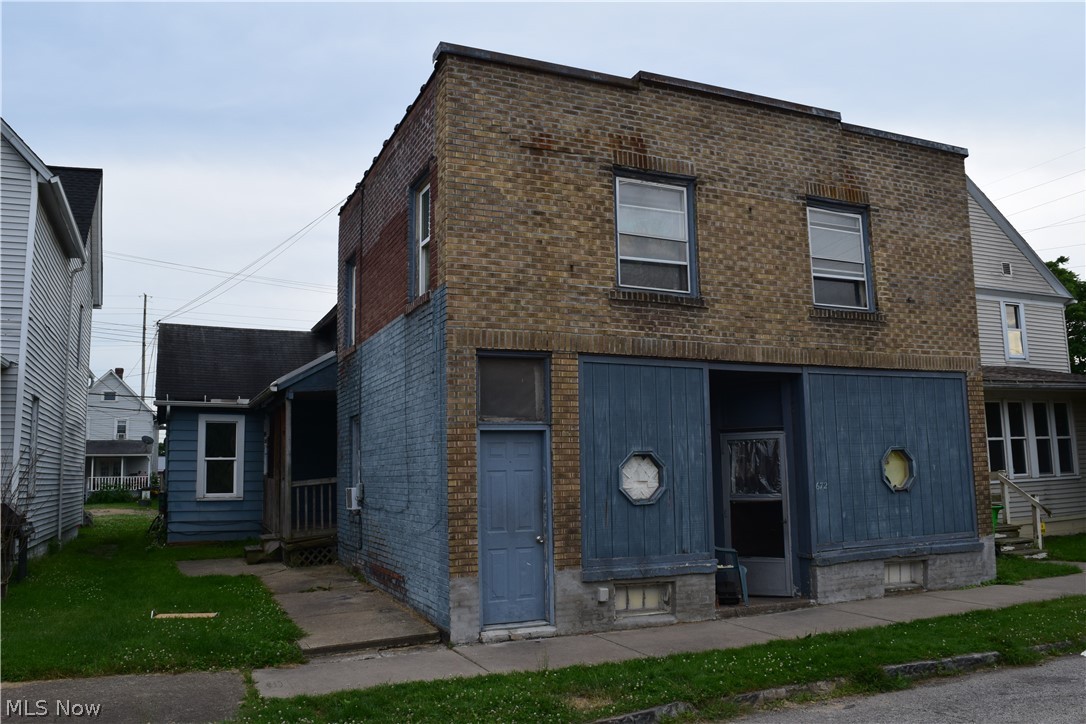 Brick four unit in downtown Barberton. Great investment opportunity! Property sold "as-is".