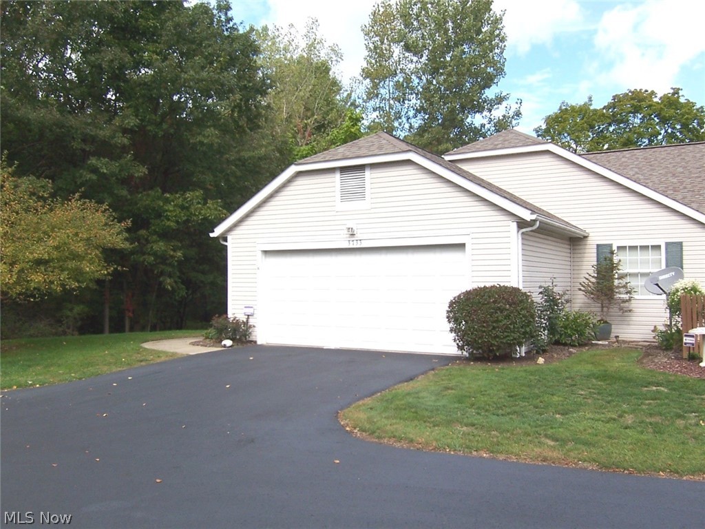 Welcome to 3733 Buckworth Ct, a RANCH condo at popular Woodbury! This condo is located on a cul-de-sac with a beautiful side yard and deep backyard that backs to a small stream. This condo has 2 bedrooms and 2 1/2 baths, and a three-season sunroom. Just off the slider from the sunroom is a nice deck for entertaining on those hot summer days! The foyer entry is open to a vaulted great room, a formal dining area, and an applianced kitchen with a breakfast bar. The large master bedroom will easily accommodate king-sized furniture, has a sitting area, and an ensuite bathroom with a step-in shower and a walk-in closet. The 2nd bedroom would be a perfect guest bedroom with the main bath just steps away. Off the garage is the first-floor laundry with a washtub and cabinets for storage, as well as a closet for additional storage or pantry use. The garage has a drain and has an additional two-foot width. On the lower level, there is a huge family room with a gas fireplace that will beg you to s