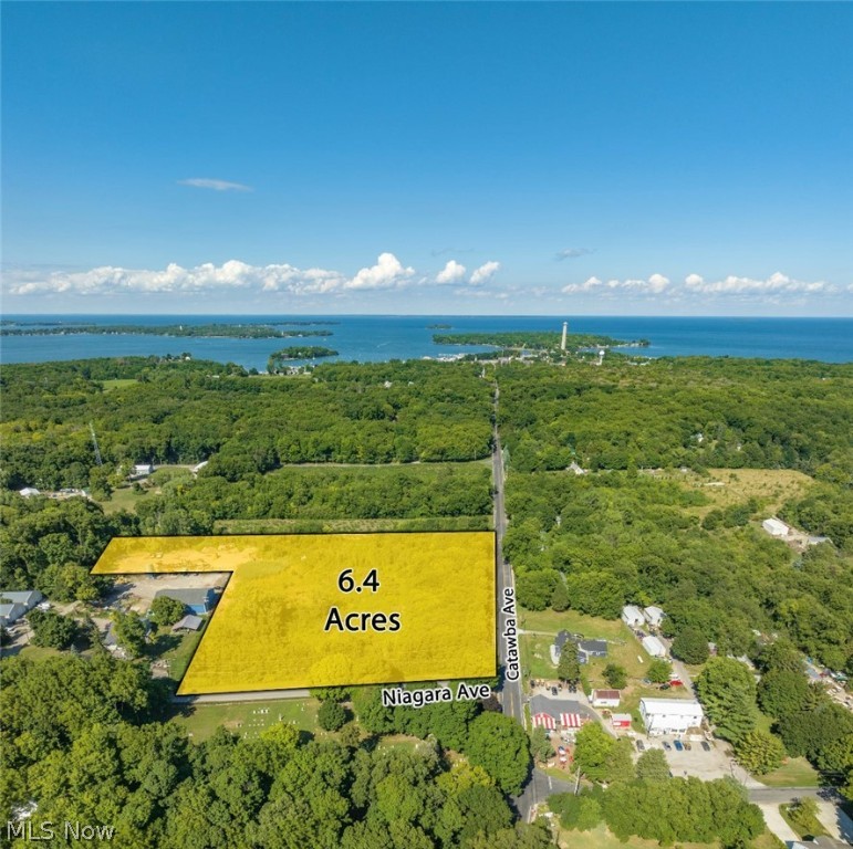 nce in a great while ... You get lucky. You find that property that ignites your imagination and that is just so right.
And here it is. Put-in-Bay Township on South Bass Island, 6.4 amazing acres of raw land situated on the corner of Niagara and Catawba roads. This rare offering of so much land is situated in one of the most desirable locations on the island.
The possibilities for how to develop the land are virtually endless, limited only by your imagination and creativity which will most certainly be ignited by the charm and natural beauty of this land. Put-in-Bay, the resort capital of the state, is one of the most sought-after locations in the Midwest. Put-in-Bay is known for scenic sunsets, fun restaurants and bars, endless outdoor and water adventures on Lake Erie and its shores and glorious and gracious living and vacationing. The magnificent South Bass Island State Park, with its gorgeous beaches, nature trails and recreational areas, is a short walk away. This property