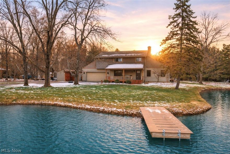 Set on nearly 3 acres of scenic land, this property offers a rare blend of privacy, space, & a peaceful, country setting while remaining conveniently close to everyday amenities. With over 3,800 square feet of finished space, the home is thoughtfully designed to balance comfort, functionality, & timeless character. Major mechanical updates were completed in 2020, including central air, furnace, tankless hot water heater, & kitchen appliances, along with a roof replacement in 2012 & updated windows. The kitchen serves as a central gathering space, featuring abundant cabinetry, bar seating, & a dedicated 2.5 gallon hot water tank under the sink for instant hot water. It opens seamlessly into the dining & living areas, creating an effortless flow for both daily living & entertaining. The family room is warm & inviting, anchored by a fireplace & framed by large windows that bring in natural light & views of the surrounding property. The primary suite has been expanded to create a private retreat, complete with an updated en suite bathroom. The additional bedrooms are generously sized, offering a comfortable & refined feel with flexibility for guests or workspace. Three of the four bedrooms, along with the main living areas, feature updated LVP flooring, while the remaining spaces are finished with carpeting for added warmth. The fully finished basement extends the living space, ideal for a home theater, fitness area, or additional lounge space, with ample room for storage. Outdoors, the property truly comes to life. The above ground pool is thoughtfully integrated into the landscape with surrounding concrete walkways, complemented by additional paths that enhance both function & flow throughout the yard. A composite deck with gazebo, half court basketball area, & a stocked pond create a setting that is equally suited for quiet evenings or gathering with others. Surrounded by open space & natural beauty, the property offers a lifestyle that feels both private & expansive