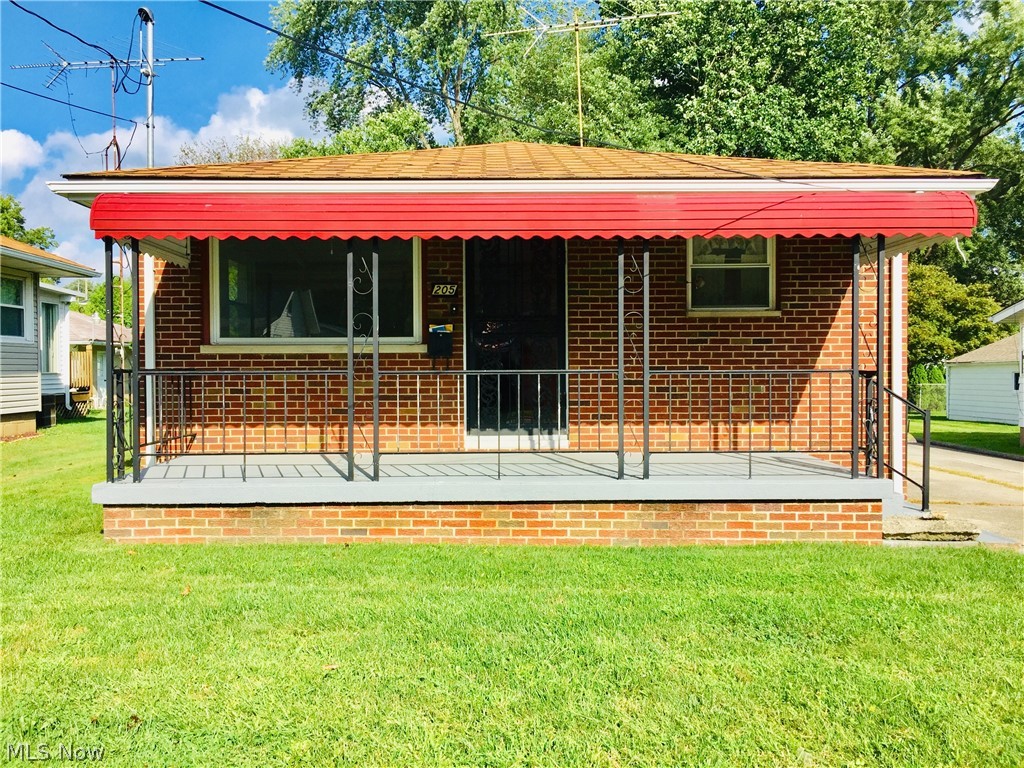 This red brick ranch home has been well maintained by one family. It features fresh paint throughout, hardwood flooring and ceiling fans in the three bedrooms, newer windows and central air. On the lower level you will find an expansive rec room as well as an office, workroom, laundry room, and full bath. Outside in the private backyard is a large two car detached garage, as well as a shed for storage. Make this house your home in this quiet Barberton neighborhood.