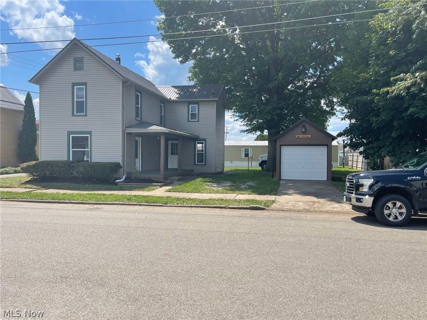 Ready to move in! All updates are finished. Windows, kitchen, bath, garage door, flooring and all freshly painted on a large corner lot.  Close to the IGA and school. Metal roof about 3 years ago.