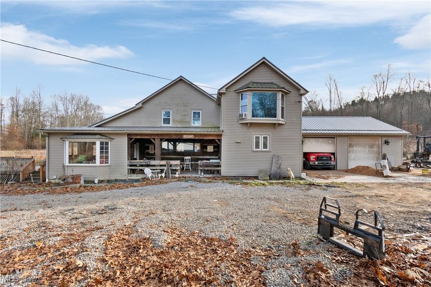 Your Private Country Oasis Awaits! Escape to the tranquility of your own 4-bedroom country home nestled on approximately 12 acres of stunning, diverse land. This property is the ultimate retreat for the outdoor enthusiast, offering a perfect blend of wooded acreage and open fields—ideal for hunting, hiking, ATV riding, and all your favorite outdoor activities. Ultimate Outdoor Living - Enjoy the peace and quiet from your large deck or the shelter of a charming covered porch. Zero Heating Bills! Benefit from FREE gas to the home. Convenient parking, keep vehicles protected with a 2-car attached garage and an additional 2-car detached carport. The kitchen is set up with all appliances remaining. For the buyer seeking an even larger homestead, an additional 40 acres adjoining the property is available for separate purchase. Note: Mineral rights do not convey with the sale. Don't miss the chance to own this private haven where nature, recreation, and comfortable living meet!