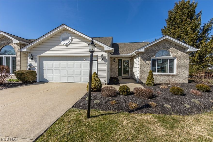 Come take a look at this very well maintained and loved Ranch home in Trails Landing of Strongsville nestled on a quiet cul de sac street with beautiful water views. This maintenance free unit supplies 2 bedrooms and 2 full updated baths. The bright and inviting foyer leads you to the open concept great room showcasing newer luxury vinyl flooring, cozy gas burning fireplace with access to the back deck with an automatic awning that will keep the sun out of your eyes. The perfect spot to enjoy the beautiful outdoors and the evening sunsets. Step into the Eat-in-kitchen with ample cabinetry, prep space, included appliances and a vaulted dining area. The master bedroom provides a ceiling fan, walk in closet & en-suite bath featuring sizable vanity and walk in shower. The second bedroom offers a ceiling fan, double door closets and shares a guest bath. The laundry room offers storage cabinets and a utility sink. The two car garage completes this 1st floor living home. One-year America's Pr