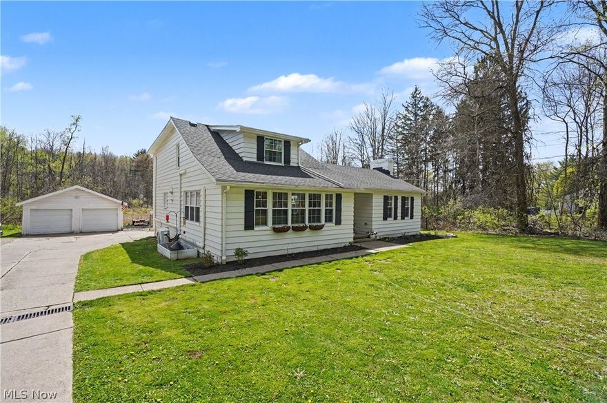 Welcome to this beautifully maintained home in Hudson, offering the perfect blend of space, style, and privacy. This 4-bedroom, 2 full-bathroom property features a thoughtfully updated interior and sits on a full acre, creating a peaceful, secluded setting while still being close to everything Hudson has to offer.

At the heart of the home is a stunning, updated kitchen designed for both everyday living and entertaining. The oversized island provides ample prep space and seating, making it a true gathering spot. The kitchen flows seamlessly into a large, open living room, giving the home an inviting and spacious feel.

Luxury vinyl plank flooring runs throughout the home, offering a clean, modern look paired with durability and low maintenance. Each bedroom is generously sized, and the two full bathrooms provide convenience and flexibility for family and guests.

Step outside and enjoy the expansive one-acre lot, where the natural surroundings create a private, tucked-away atmosphere. Whether you're hosting, relaxing, or simply enjoying the outdoors, this property offers the space and setting to do it all.

A rare opportunity to own a move-in-ready home with modern updates, functional layout, and a truly serene yard in one of Northeast Ohio’s most desirable communities.

Updates: Carpet 2025, Hot Water Tank 2023, Sump Pump 2024, Oven 2026, Roof 2021, all new electric, appliances, and interior in 2021 (complete renovation). Flat roof maintenance in 2023. Fire pit added in 2024, chicken coop built in 2025, new septic pump 2022.