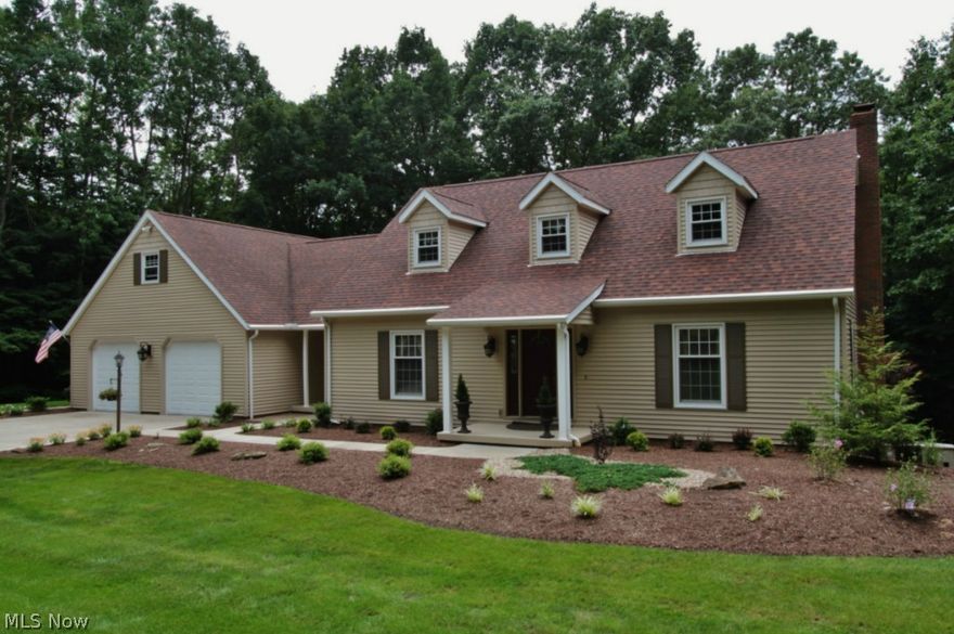 Country living in the city! 9 acres M/L surround this gorgeous, immaculately maintained cape cod home, tucked away in privacy within close proximity to shopping, hospitals, and dining! Beautiful wrap-around deck on the rear overlooks nice wooded area. Full, finished walkout basement with lower level kitchen, bedroom, and full bath, opening out onto covered patio. This would make an excellent set up for an in-law suite or guests visiting but still in need of privacy. Custom kitchen and island with granite countertops, solid oak woodwork throughout and open beam cathedral ceiling in sunroom. 28 x 32 garage (4 cars end to end). Nice 1st floor laundry, study and master suite! Easement access to property. Property is also available with 1 acre M/L for $279,900.  It you want privacy, yet all the conveniences to being in town, then you need to see this beautiful home!