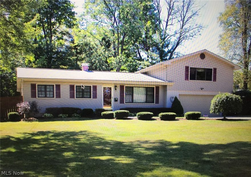 4-5 Bedrooms, 1 1/2 bath, livingroom, diningroom, large covered 16 x 20 deck overlooking fenced private park-like backyard with many perennials and an outbuilding.  Pella windows, central a/c, whole house exhaust fan, 2 car garage.