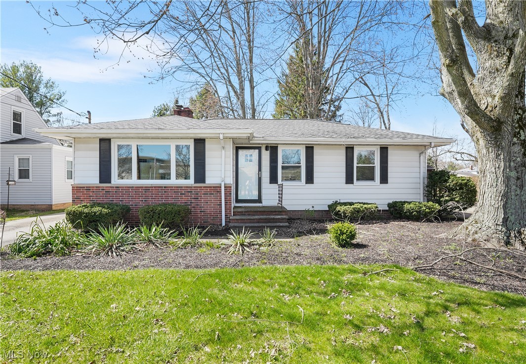 Welcome to this beautifully updated ranch home in the heart of Solon! This home offers the ease of single-floor living with abundant natural light throughout. From the moment you step inside, you'll be captivated by the fresh paint and freshly refinished hardwood floors that extend through much of the home. The spacious living room, featuring a cozy wood-burning fireplace, seamlessly flows into the dining room, creating an inviting space for gatherings. The remodeled kitchen is a showstopper, boasting luxury vinyl flooring, soft-close white cabinets, granite countertops, and brand-new stainless steel appliances. An eat-in area with built-in cabinets adds convenience and charm. The main floor also includes two comfortable bedrooms and a completely remodeled full bath, styled with contemporary finishes. The full basement provides ample storage space and awaits your personal touch for finishing. Numerous updates completed in 2024 include a newer roof (house and garage), water tank, windows, kitchen appliances, remodeled kitchen and bath, refinished hardwood floors, fresh paint throughout, new garage doors, man door, screen doors, and glass block windows in the basement. Located just minutes from the Market District, schools, the recreation center, and downtown Solon, this home combines modern updates with an unbeatable location. Move right in and start enjoying everything this charming home and its prime location have to offer!