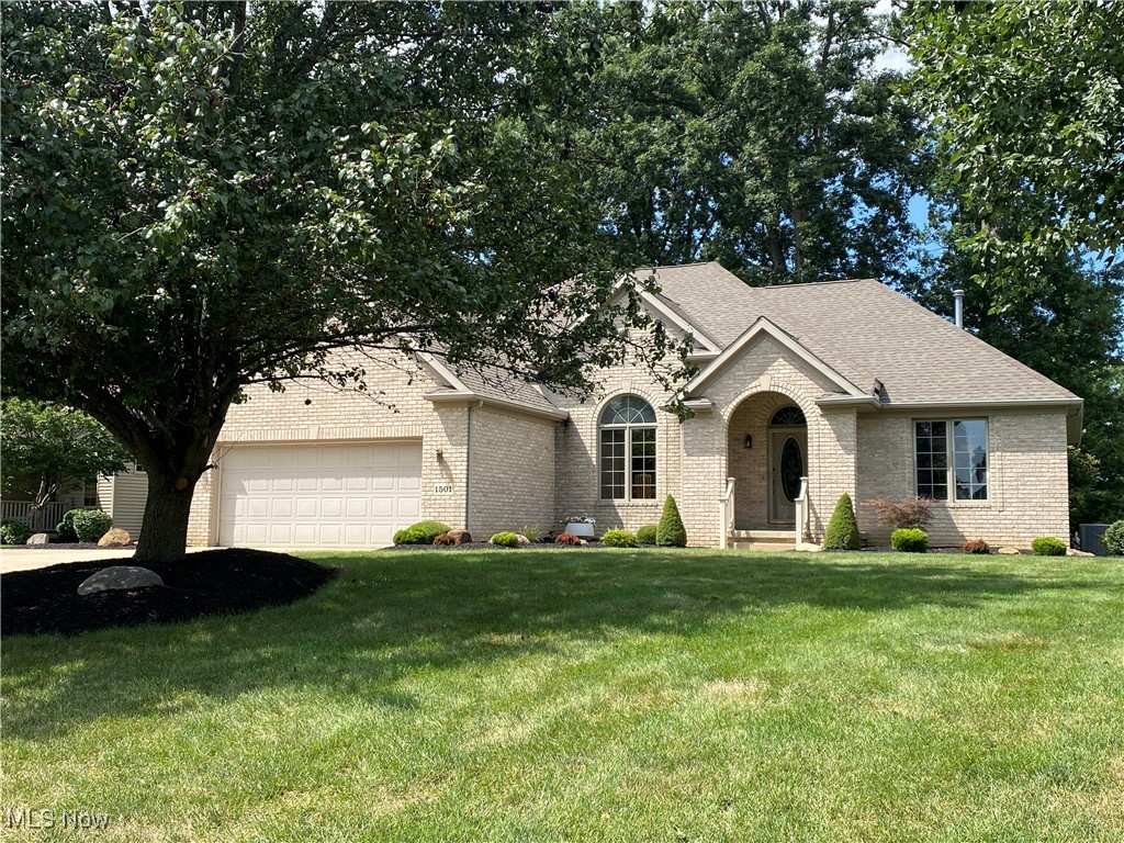 Welcome to 1501 Spring Wood Ln! This well-maintained, move-in ready, corner-lot home offers 3 bedrooms and 2 full baths in the Green Local School District. The foyer opens to a dining room, hallway leads to the kitchen with ample cabinetry and a cozy nook featuring a two-sided gas fireplace shared with the spacious family room. Hardwood floors and solid wood doors run throughout, with carpet in the family room and bedrooms. The master suite includes a large walk-in closet and double sinks, while a second bath serves the other bedrooms. The lower level is framed for finishing and has glass block windows. Located near Green Schools and within walking distance of Bulldog Stadium; new schools coming 2025-2026. Recent updates include a new stove, dishwasher, microwave (2024), 12 x 16 wooden shed with half loft for above ground storage (2020), and HVAC (2019). Current owner is third generation, the home has been in the family since construction.