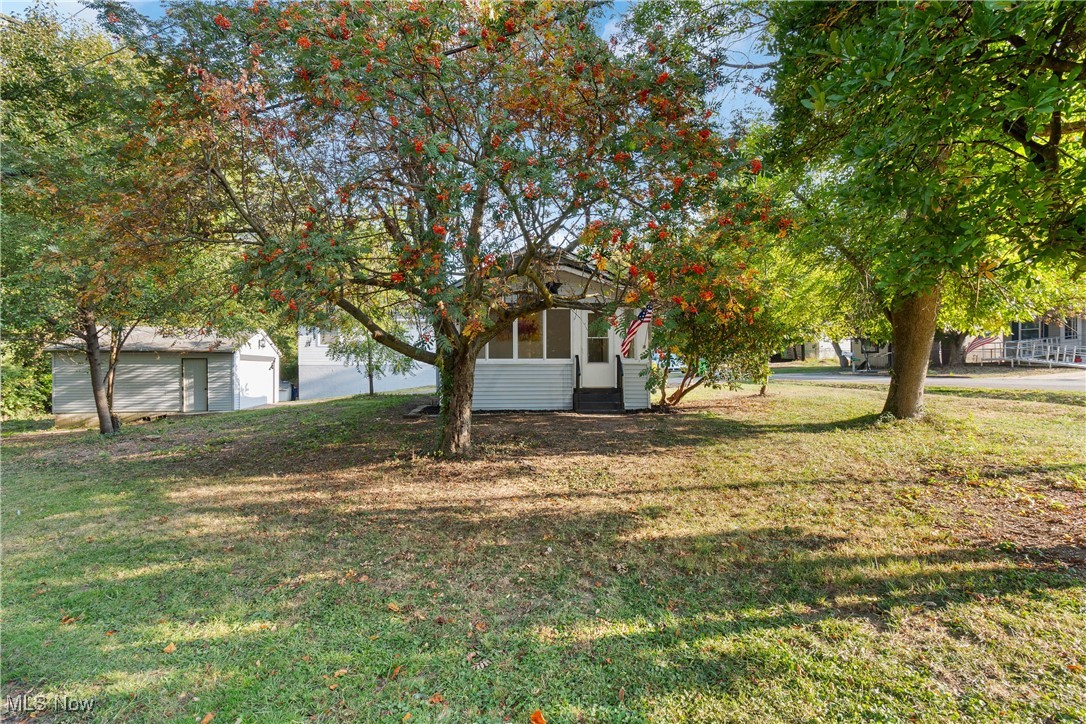 Welcome to this newly remodeled, turn key home in an adorable, quaint neighborhood. Everything in this home has been updated! The home features two nicely sized bedrooms and one bath, perfect for first floor living. Home sits nicely on a large corner lot, with mature trees on a quiet street. The large detached garage provides plenty of parking and room for storage. Find the perfect spot to sit and relax on the newly updated screened in front porch, which also provides an additional bonus space. Updates include: brand new roof, siding, windows, fascia, new vinyl flooring and paint throughout, brand new stainless steel appliances and granite countertops, fully updated/new bathroom and kitchen, brand new central air conditioner, hot water tank, and more! This home will not last, set up your private showing today.