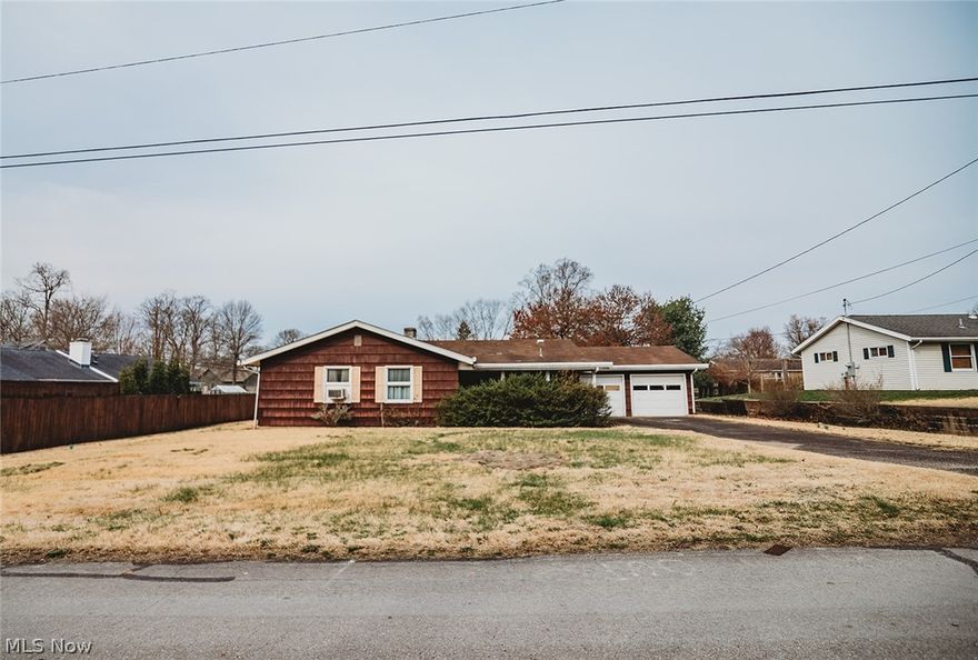 Amazing opportunity to bring a beautiful single-level, mid-century modern home back to life! Situated in the sought-after Devola area, this home is still in the original family that had it custom built in 1956! Cosmetic improvements is the phrase of the day when considering this home. 1,368 easy-flowing square feet and three ample bedrooms compliment a huge living room, complete with a wood-burning fireplace and picture windows for ambiance. While lounging in your living room next to your fire, take in the view - just past the enormous screened-in patio - to the humongous level back yard. This place is worthy of breathing life back into it!