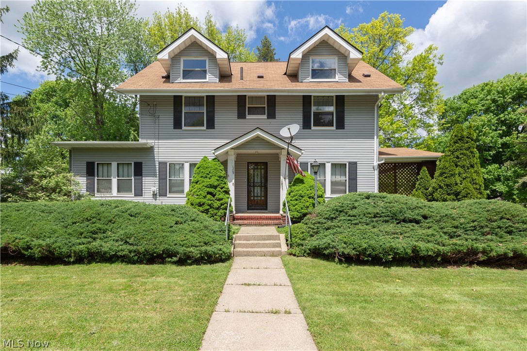 Large Goodyear Heights Colonial with 3 bedrooms and a Large Master, the Kitchen is spacious and has a pantry, living room with fireplace and french doors from dining room open to living room. Hardwood under carpet. Lots of built ins. First level also has an office/game room that could be used as a first floor bedroom. 2nd floor can have it's own entrance and there is a kitchenette in one of the bedrooms. 2 Additional rooms in the attic with heat can be used for an office/studio. LED lighting through out. Newer boiler, siding & roof. Home sits on a double lot with a large tandem 4 car garage and shed.
