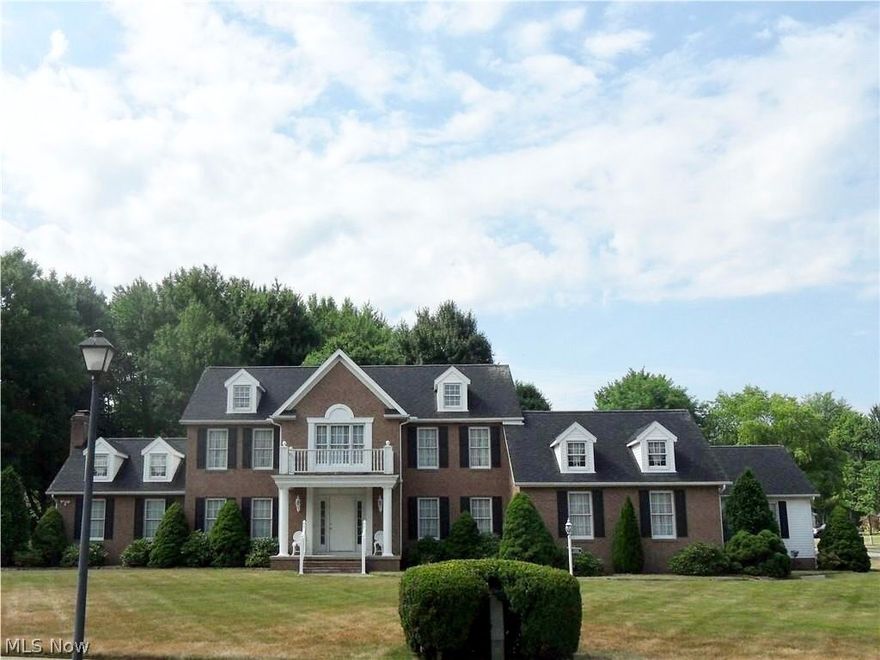 This beautiful custom designed and built colonial is located in Chenowith Country Club Estates and sits on 2 lots, totaling 1.2 acres. A few of its features include first and second floor master suites, a total of 5 bedrooms, custom woodwork throughout, 6 panel doors, first floor laundry, monitored security system, a 4 plus car garage with hot and cold water, and a second stairway to the basement. The large kitchen has ample cabinets, a 5 burner stove and new dishwasher. The dinette provides 1 to 2 access points to the deck from the house. The formal dining room boasts a beautiful tray ceiling and woodwork. The large great room has a gas log fireplace with custom woodwork and marble, 2 open dormers grace the wonderful cathedral ceiling. The deck can also be accessed through the great room. This 5 bedroom home has a very large first floor master suite with cathedral ceiling and dormers. The master bathroom features a large soaking tub, double vanity and enclosed shower. This master suit