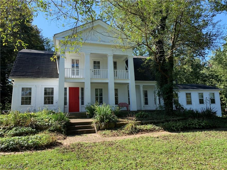 Lots of opportunities to live your dream  in this beautiful historic century home, built in 1880 on 3.9 private acres.There is a big covered front  porch.  5+ bedrooms and 2 1/2 bathrooms which gives you plenty of space to spread out and includes a first floor In Law suite w/ full bath and family room. Hardwood floors thru out. Beautiful wood paneled wood burning fireplace in spacious formal living room. Formal dining room connects to the butler pantry with cupboards for extra storage and plenty of space for an extra table. There is a screened in porch attached to the butler's pantry. Eat in kitchen with lots of of cupboards, double wall oven and stove top range. First floor laundry with washer and dryer. 1/2 bath has 2 big closets. A special feature is the library/study with built in bookshelves. The second floor has 5 bedrooms including master  w/ a walk in closet. Bedroom 2 has 2 walk in closets. Bedroom 3 has a private balcony that overlooks the front yard. The full bath has been updated. The walkout basement has a family room and bedroom or craft room. The rest of the basement has a workshop and plenty of storage. Detached 2 car garage, a 2 story barn, a storage shed, several fruit trees, plenty of room for a large vegetable garden and a big barnyard for  farm animals including horses. Close to Route 8, Cuyahoga Valley Parks and trails, restaurants & stores. All nature amenities yet close to town.  Agent related to owner.