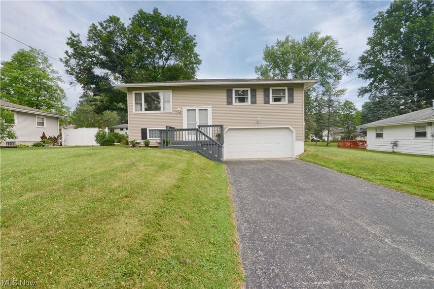 Wow! If you are looking for a home with a great floor plan, excellent exterior and great back yard, this may be one worth looking at! Not only do you have a freshly painted front porch leading to your new home, the back of the home offers a beautiful second floor trex deck with vinyl handrails and staircase to the open backyard! Walk in to a spacious foyer that leads to the main living space! Eat in kitchen with lots of cabinets, ample counters and appliances stay for the new owner! Formal Dining has doors leading to the deck and the living room offers great natural lighting! Three beds and a full bath complete this level! Gorgeous hardwood flooring under the carpets! The lower level gives access to the attached double car garage, a finished family room and the laundry room/utility room also has a second sink, toilet and shower! With a little updating you could have a wonderful enclosed second full bath! Central air! Plenty of potential for someone wanting to turn a house into a home!