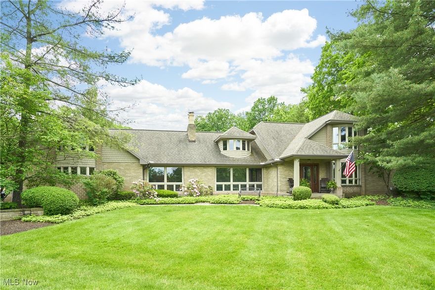 Incredible 20+ Acre Estate with the Main House, Guest Cottage, Cabin, & 6 stall horse stable located on the West Branch of the Rocky River. This home was built for the convenience of everyday living & extensive entertaining. Endless adventures await: camping next to the river, ice skating in the winter, football games in the front yard; all on your OWN property. The main house features 4 bedrooms & 4.5 Baths, including first-floor master suite w/180 degree views of this park-like property. The chef's kitchen is completely open to the family room w/woodburning FP, beamed ceiling, spa & wet bar. 2 separate staircases lead to the second floor w/3 spacious bedrooms & 2 full baths. Walkout lower level w/kitchenette, workout room & full bath. Laundry rooms on both the 2nd floor & Lower Level. French Doors throughout the home lead to multiple patios & decks, ideal for outdoor entertaining. Rear patio features built-in grill & beautiful waterfall feature. Guest cottage features 2 bedrooms, 1 full bath, full kitchen, and living room w/fireplace. The cabin features forced-air heating. Main House New Roof (2016), Guest Cottage New Roof (2020). Recent improvements include: New flooring (2025), renovated master bath (2025), kitchen remodel including new granite countertops, flooring, sinks/Kohler faucets, Viking range, dishwasher, wall oven, and microwave (2024-25), New tin roof on barn (2024), Added Generac Full Home Generator (2023), driveway resurfaced (2024), new Pella doors in kitchen and master bedroom (2025), New HVAC/AC & hot water tank in cottage.