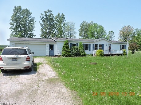 Spacious Ranch Home On Nice Double Lot Directly Across From The Lake Includes All Roaming Shores Amenites (Pools, Lake, Beaches). Den Has French Doors, Spacious Kitchen With Extra Area For breakfast nook, and Has ample Cupboards And Great Countertop Area. two full baths, 3 bedrooms, airy living room and 2 car attached garage!