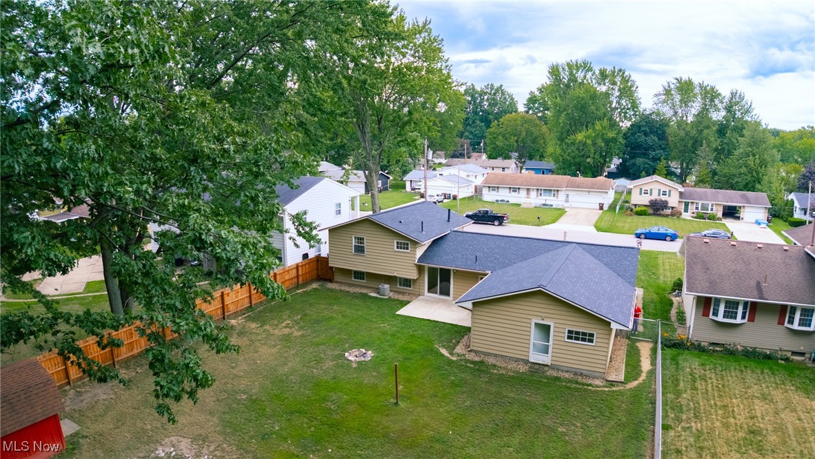 Welcome to your retreat in the city! This spacious split-level home sits on nearly an acre, giving you that “out in the country” feel while still being just minutes from shopping, dining, schools, and all that Elyria has to offer.
Step inside and you’ll love the blend of updates and charm. Durable vinyl plank flooring runs through the kitchen, bathrooms, family room, and living room, while the original hardwood floors in all three bedrooms add warmth and character—perfect for easy cleaning and allergy relief.
The kitchen is the heart of the home, featuring stainless steel appliances, expansive countertops, and plenty of cabinet space. It’s semi-open to the living area, so whether you’re hosting family dinners or casual get-togethers, everyone stays connected. Both bathrooms have been recently updated with modern finishes, giving you a fresh, move-in-ready feel.
On the main level, the oversized living room is filled with natural light, while the lower-level family room offers the perfect hangout for movie nights, kids’ play space, or game-day gatherings.
Hobbyists and DIY lovers will appreciate the 2 ½ car garage with a massive workshop space behind it—ideal for projects, storage, or creating the workshop of your dreams.
Step outside to your private backyard oasis: a large fenced-in yard shaded with mature trees, perfect for kids, dogs, and evenings spent around the firepit. There’s even a shed for all your yard tools and toys.
Updates give peace of mind: a brand-new roof with transferable warranty, hot water tank (approx. 1 year), and furnace (less than 3 years). Plus—all appliances stay, so you can just move right in and start enjoying your new home.
Room to grow, space to entertain, and updates already in place—this is the Elyria gem you’ve been waiting for!