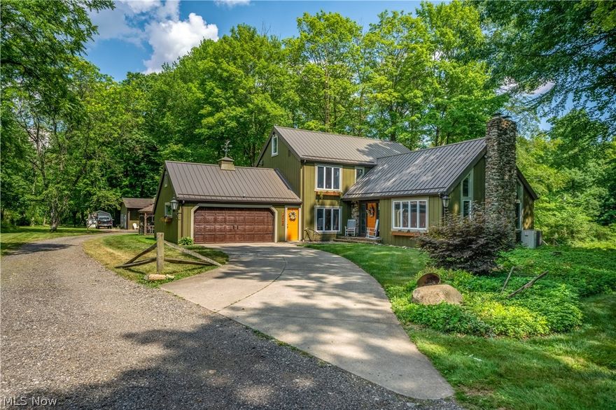 This stunning home overlooks 7 acres of beautiful woods.  This amazing one of a kind home offers 3/4 bedrooms and 3 full baths.  Gorgeous updated kitchen with quart countertops & stainless steel appliances.  This amazing property overlooks the peaceful Deer Creek!  The abundance of windows allows year round views of this serene setting.  2 authentic stone fireplaces.  The back building offers every owners dream - perfect for overnight guests, private home office or outstanding man cave.  This home has been updated from top to bottom & is move in ready!