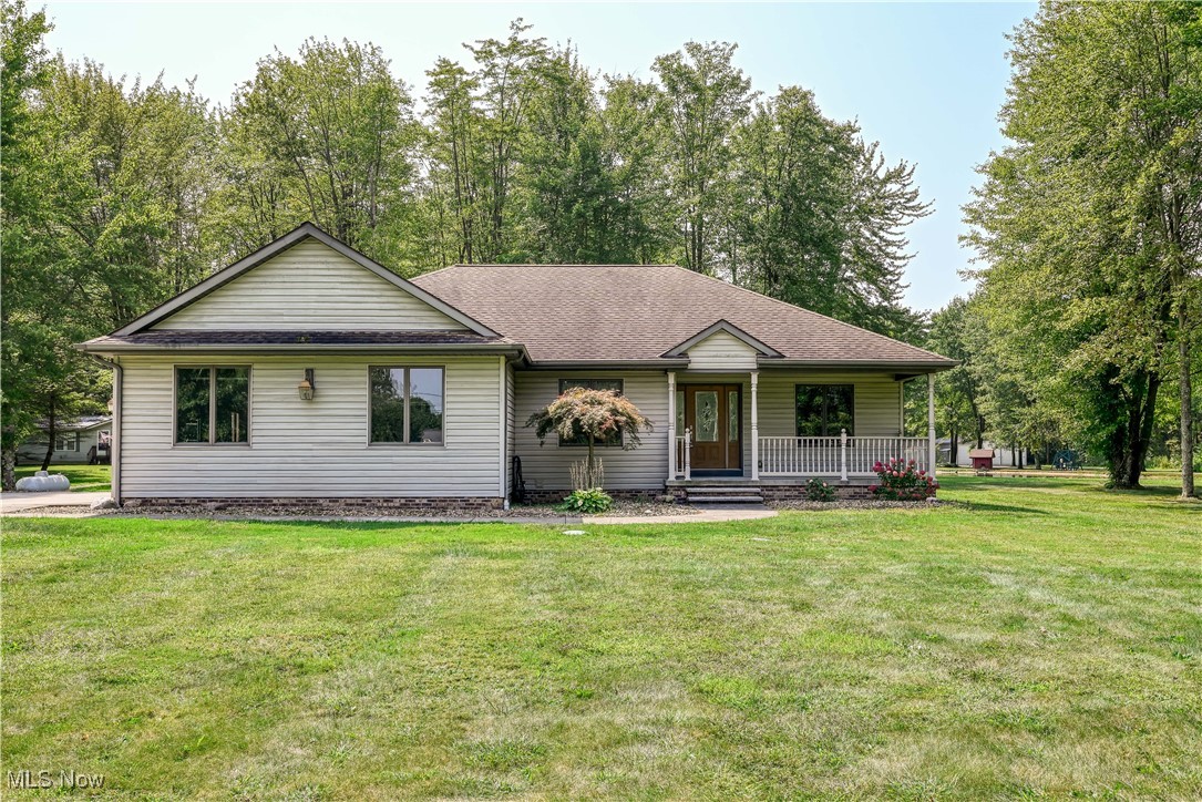 Quality built ranch home in Hiram township set on 5.5 acres of mostly wooded land. 3 bedrooms and 2 full baths with a split floor plan. The inviting entry with hardwood floors and a coat closet welcomes you in. The Dining room is to your left with a chandelier and the living room straight ahead. From there the attached sun room is the place to be with all the windows and natural light. All rooms have ceiling fans. The primary Bedroom with attached bath is handicap accessible with extra wide doors and zero entry shower. Dual sinks and a walk-in closet finish out the primary bath. 2 other bedrooms and a bath on the opposite side of the house. The full bath in the hallway offers a soaking tub/shower combo. The Kitchen has oak cabinets and is fully applianced with an eat-in kitchen and breakfast bar. In the basement you will see the 2x6 construction and extra insulation which help to make this home more energy efficient. You can enter the basement either through the hallway in the house or from inside the attached 2 car garage with side entry. The basement has an extra course of block and is a blank slate for anything you need it for. You will be shocked how big it is with additional crawl space under the sun room. Choose from the front porch for siting and relaxing or the back deck, both are great to soak up the peaceful setting. Carpets recently cleaned and neutral paint round out this move-in ready, rare ranch find!