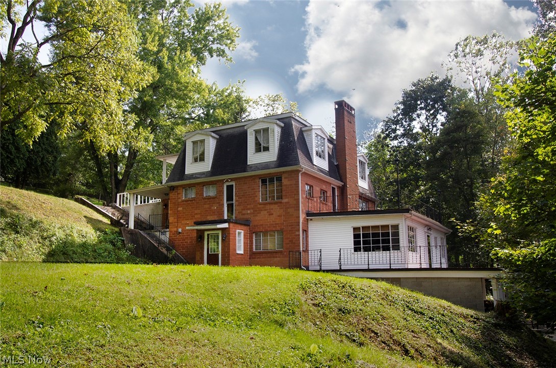 Don't miss the opportunity to have this unique home on Tappan Lake Front. This home is located on approx 1 +/- acres of private ground offering over 3400 square-foot of home with three balconies. The outdoor covered patio faces the lake with decks on level 1 and level 2 overlooking the lake. This home is full of so much character, including beautiful hardwood floors, large wooden staircase, his and hers bathrooms, an oversized kitchen with a large walk in pantry. Large bonus room and great room. There are six bedrooms, three full bath and 1/2 bath and a cozy fireplace. Make it your vacation home to enjoy with family and friends or a home you can live in permanently. This also would make an excellent rental property. Home furnishings are negotiable. Call today for your private showing.