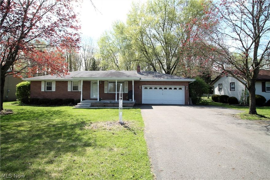 Welcome home to this charming brick three bedroom, possible 4 bedroom, two full bath ranch home. Enter from the new front porch, and new concrete walk into the great room with wood floors through out the main level. The large bright eat in kitchen offers abundance of counter space and cabinets, stainless steel appliances, Insta Hot at the sink for that fabulous hot cup of tea etc, work area, and large eat in dining area. Plenty of windows to let the natural light shine through. There is a remodeled full bathroom and three bedrooms on the main level. The lower level is partially finished and has new ceiling tiles with the finished area currently being used as a fourth bedroom. There is a full totally rebuilt bathroom with new shower door and shower seat stays with home and supports 350lbs, laundry room, tankless HWT, plenty of room for entertaining etc. The large backyard offers so much room for just enjoying or entertaining and there is a large shed and three car outbuilding.  Two car