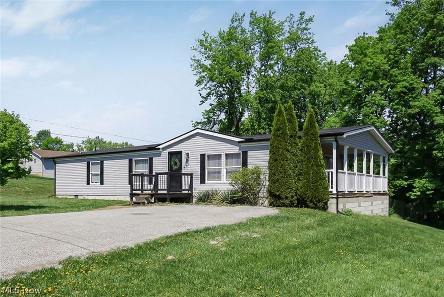 Welcome home to this beautiful one-story gem located in the highly sought-after East Muskingum School District! This 3-bedroom, 2 full bath home offers the perfect blend of comfort, style, and functionality. Step inside to find a spacious, open living room ideal for relaxing or entertaining. The remodeled kitchen is a standout feature, showcasing stunning concrete countertops, a stylish island, and plenty of space for cooking and gathering. The dining area flows seamlessly and leads directly out to a huge covered deck—perfect for outdoor dining, hosting, or simply enjoying your morning coffee. The private primary suite offers a true retreat with a full en-suite bath complete with both a garden soaking tub and separate shower. Two additional bedrooms and a second full bath provide plenty of space for family or guests. Enjoy peace of mind with major updates already completed, including a new roof and siding within the last 3 years, a hot water tank within the last year, and an AC unit that is approximately 3–5 years old. Outside, you’ll love the fully fenced backyard—ideal for pets, play, or added privacy. This home combines modern updates with everyday convenience in a fantastic location. Don’t miss your chance to make it yours!