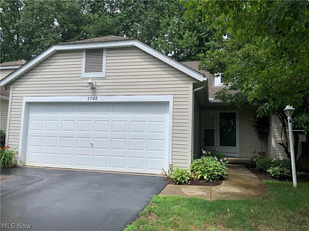 Woodbury Condo! Nestled in the heart of Stow this 2 Bedroom, 2.5 bath is move in ready. As you enter, you will love the open spacious floor plan. The great room with vaulted ceilings walks out to the private patio with newer landscaping. The kitchen offers newer stainless steel appliances and a breakfast bar. There's room for your dining furniture as well. The first floor master bedroom, features a walk in closet and well appointed master bath. The convenient first floor laundry, with washer and dryer, is just steps away. Upstairs you will find the loft that overlooks the great room, the second bedroom and another full bath. There is a large walk in storage area, as well. The lower level offers a spacious family room and office area, too. Lots of storage. Updates include range 2019, dishwasher 2020, Refrigerator 2013, disposal 2015, washer/dryer 2016, furnace and central air 2013. The attached garage has additional storage, water and a heater. Showings start Friday July 16.