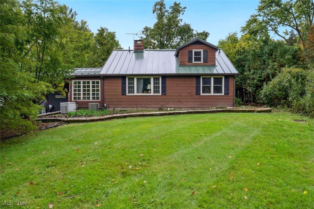 Welcome to your own country retreat. This home has two first floor bedrooms and a partially finished second floor bedroom just waiting for your final touches. Original hardwood flooring throughout with granite kitchen countertops and custom backsplashes. Enjoy the beautiful fall weather on your huge back patio working in the greenhouse or stroll the nearly two acre property past the spring fed pond. Warm up in front of your wood burning fireplace on cold evenings. On stormy nights have no worries about losing power as your Generac Home Generator kicks into action. Literally topping off this home is a long life, low maintenance metal roof. Property being sold As-Is, Seller will make no repairs.