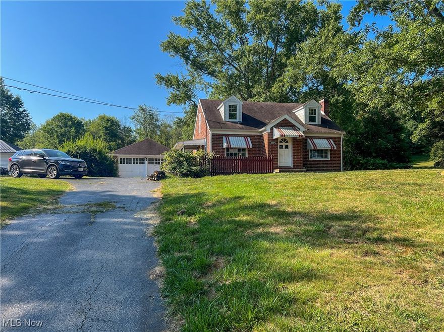 HUD Home Selling AS-IS. Three-bedroom two-bathroom brick home on a double lot and a brick two-car detached garage. The first floor of the home has two bedrooms, a full bathroom, a large living room, an eat in kitchen, and a small foyer. Upstairs the home features a reading nook, a large bedroom, and a tv/game room. The laundry and second bathroom are located in the basement. Outside the home has a covered side porch, a front patio connected to the porch, a detached two-car garage, and a huge yard.