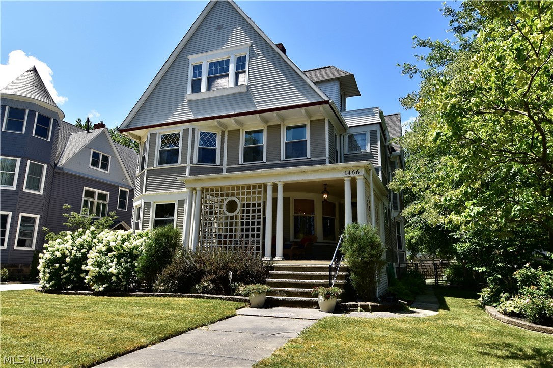 Amazing home inside & out, located on a street of gracious Lakewood homes! Original character enhanced by meticulous maintenance. Hardwood flooring, detailed natural woodwork, leaded-glass windows, pocket doors, multi-paneled wood doors, bay & bow windows, coved ceilings, 2 fireplaces with magnificent mantels, unique built-ins, 1st-floor half bath & abundance of rooms all add to the exceptional appeal of this home. Updates include recently refinished hardwood flooring (1st floor & 2nd-floor stairway), eat-in kitchen, beautiful baths, replacement windows, multiple electrical panels, rehabbed garage, backyard fencing, front porch flooring. First floor has living room, adjacent family room, charming bar in nook with cabinet included, large formal dining room, eat-in kitchen. Kitchen was recently updated with upgraded countertops and appliances. Finished 3rd floor (included in total above-grade square footage) has a full kitchen, full bath, and 3 rooms with many possible uses (currently as