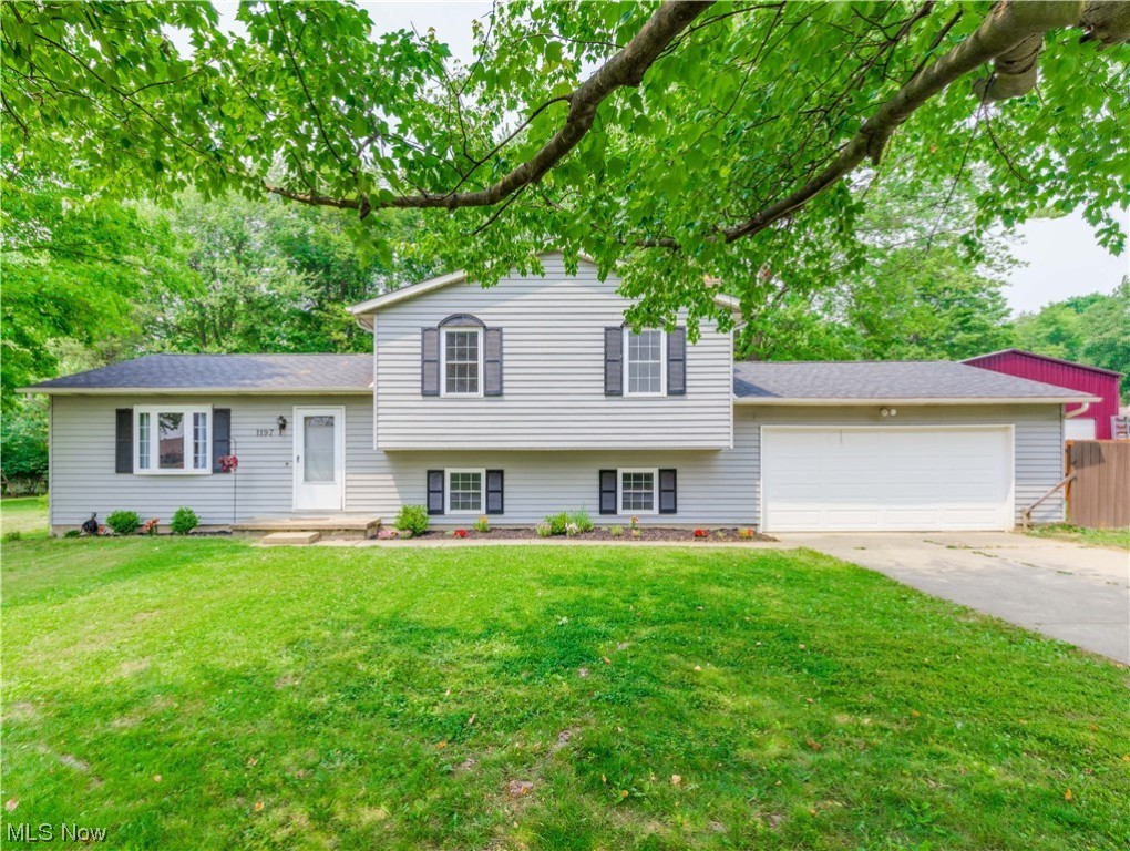 This Brimfield beauty just might be the one you've been waiting for. This attractive 4 level split is conveniently situated near I-76, shopping and is within the Field local School District. Step into the formal living room that is open to the dining area and leads to the kitchen. This area is light, bright and open. Beautiful kitchen with light colored cabinets, subway tile backsplash, granite counters and stainless appliances. Sliders to the deck overlooking the private backyard. Up a few stairs to three bedrooms and a beautiful bathroom. Down a few steps to a family room with fireplace and an area that was converted to create an office and 4th bedroom but designed to easily be converted back to one room. Then there's a basement with a full bath and rec room or work out room. Updates include a complete tear off roof in 2019, central air in 2019,exterior painted in '19, a repurposed shed in '16, new gutters in '16, updated electric panel, newer well pressure tank and water softner