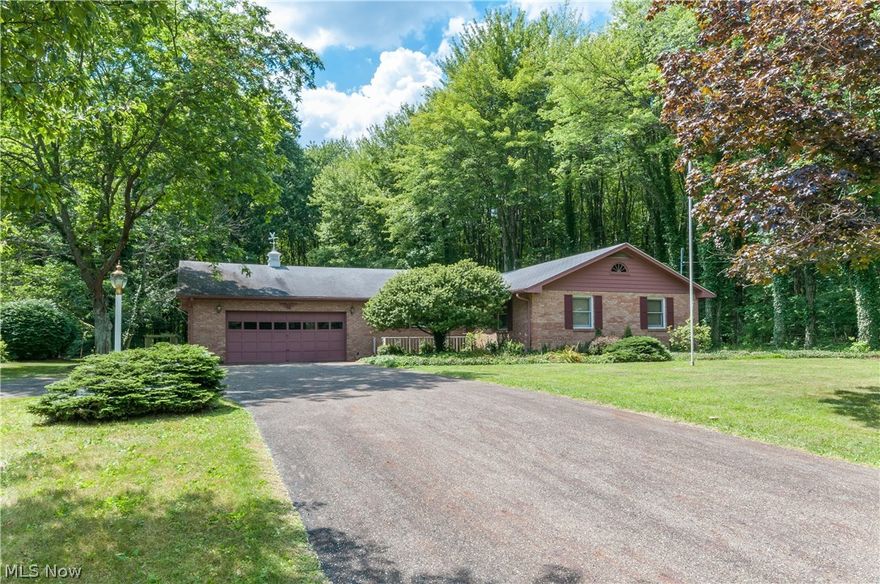 Welcome home to this all-brick ranch featuring first-floor living at it's finest!  This neighborhood is located in a park-like setting and the home is very secluded by all of the trees in the backyard.  Enter the home through the nice foyer with ceramic tile and into the huge dining room with wonderful hardwood floors.  The dining room is open to the kitchen, which also has a breakfast bar.  From there, make your way into the spacious great room, featuring a brick fireplace.  Off of the great room is a great enclosed porch with electric.   Head down hallway, which features two large linen closets, to the two good-sized bedrooms and full bathroom.  The basement features a dedicated workshop area, a finished bonus room, and extra-large closets, perfect for storage. The two-car attached garage conveniently has electric and water access.  You'll love the setting and layout of this home, and enjoy the home warranty offered for peace of mind!