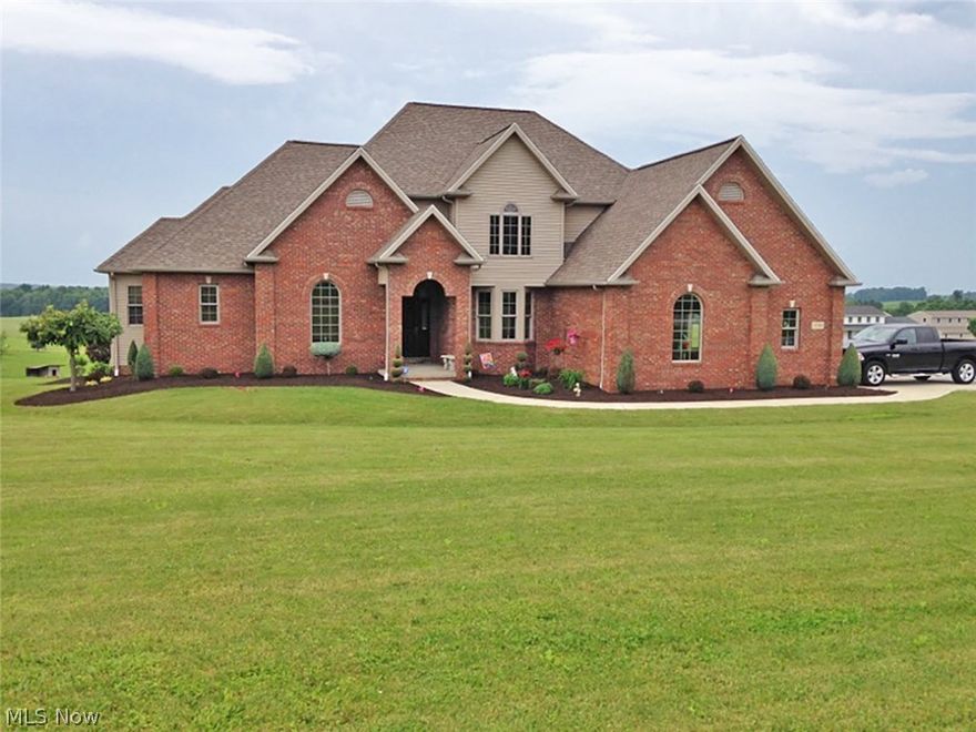 This exquisite 2 story home has been expertly maintained and is situated on 2.08 acres.  The stunning foyer with a high granite plant ledge and cherry floors leads to the 2 story great room that features a gas fireplace and a wall of windows overlooking a country view. A column and bay window set off the formal dining room.  Beautiful cherry kitchen has granite counters and an adjoining dining area divided by a raised counter bar. Relax in the attached family room with a railed opening to the stairway and French doors to the rear deck.  First floor master suite has a private master bathroom with corner tub, two counters, shower, vanity and walk-in closet.  The main level also features a laundry room, ½ bath and a den w/ access off the great room and master BR.  Stairway from the kitchen and foyer leads to landing that goes to three upper level bedrooms and a full bath.  Beautiful cherry woodwork and 6 panel doors through out.  The open floor plan in the finished walkout basement offers