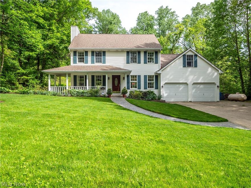 Stunning 3 bedroom 2.5 bath home set on almost a half acre of private wooded lot. Walking in the front door you will notice a large foyer, beautiful hardwood flooring throughout the main level. Formal dining room and huge Great Room with fire place. The kitchen is an absolute show stopper. Stunning custom built cherry cabinets, granite counter top, top of the line stainless steel appliances with induction cook top. The half bath also has a custom vanity. Head out back to the 4 seasons room and be stunned by the ample light that over looks your backyard oasis. The first floor is finished off with a laundry room. Head up either of the two staircases to the second floor. You'll find 3 bedrooms, the master has ample closet space and a recently renovated bath. Head down the hall to the huge bonus room with custom built in cabinets. The room can be used as a bedroom, game room or office! No detail was overlooked when the owners built and kept up this amazing home.